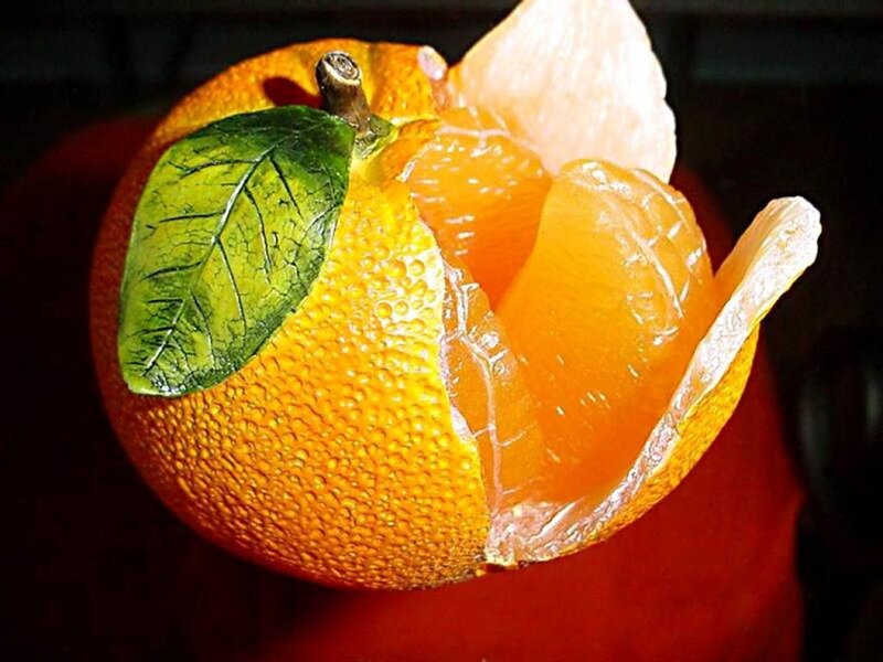 Peeled Orange Fruit — Dramatic, Photograph, Leaf