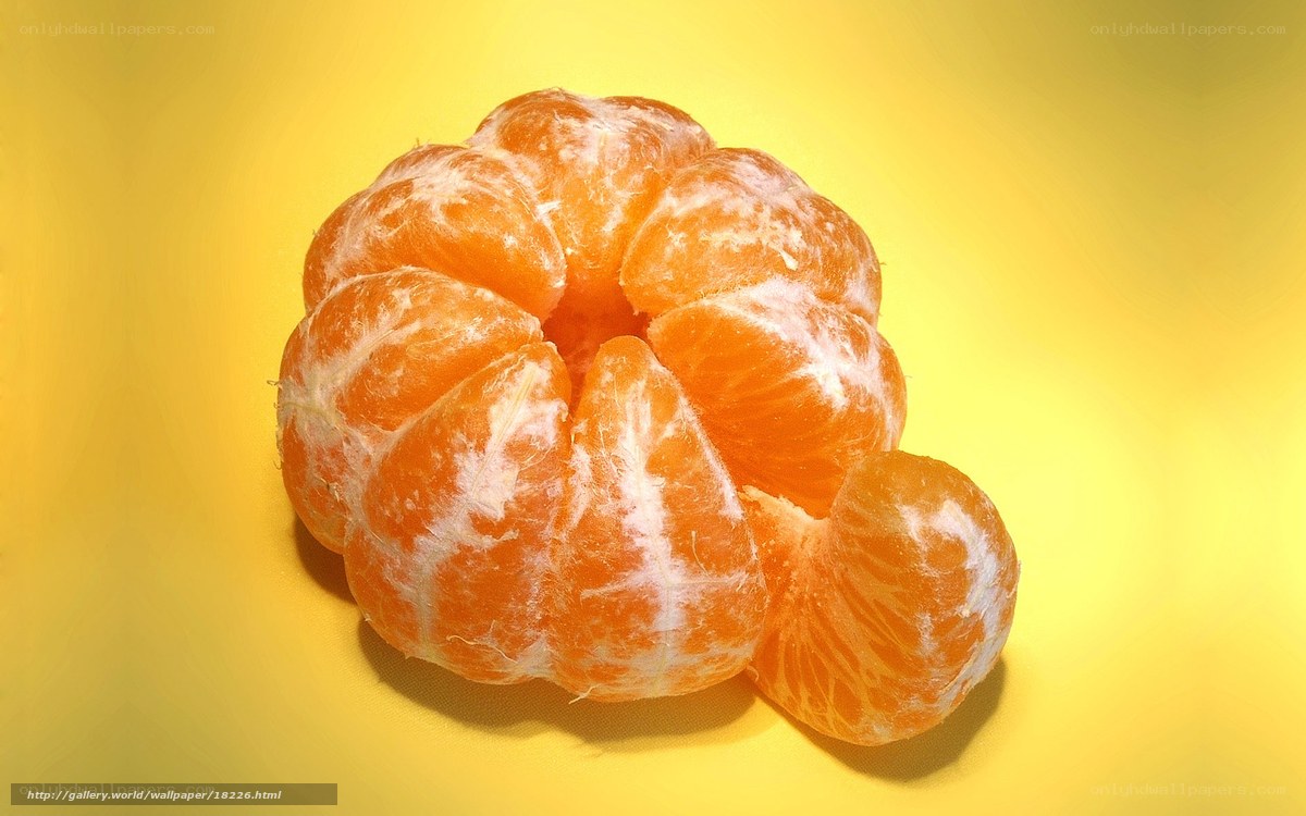peeled tangerine on yellow
