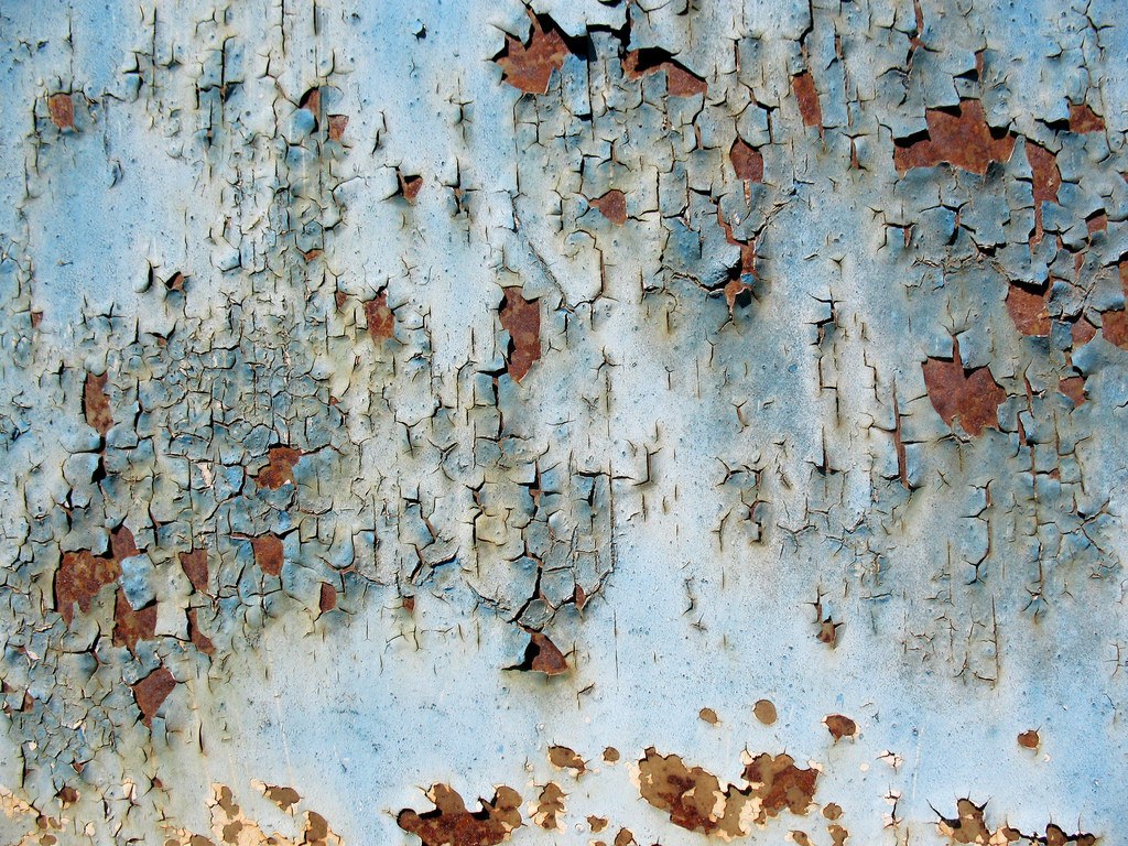 peeling blue paint on metal