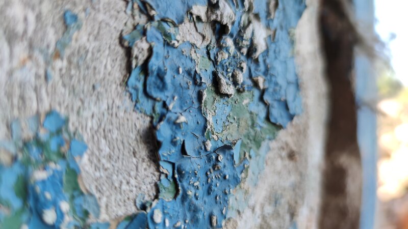 Peeling Blue Paint on Wall