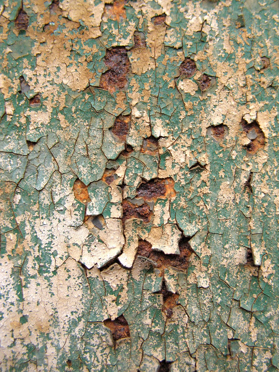 peeling green paint on metal