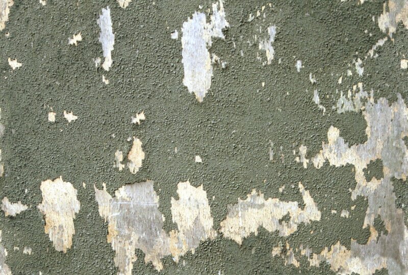 peeling green paint on wall