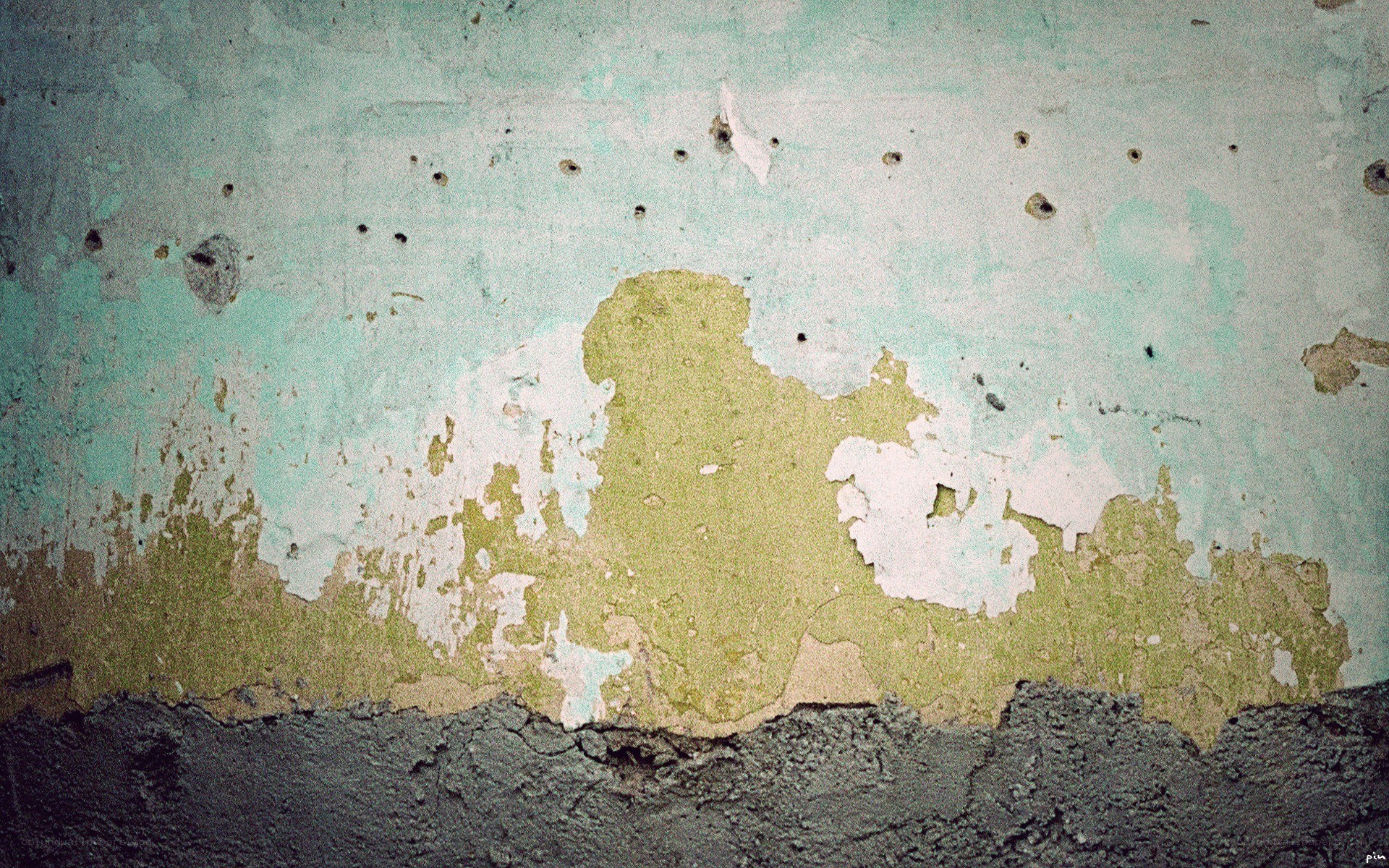 peeling paint on a weathered wall