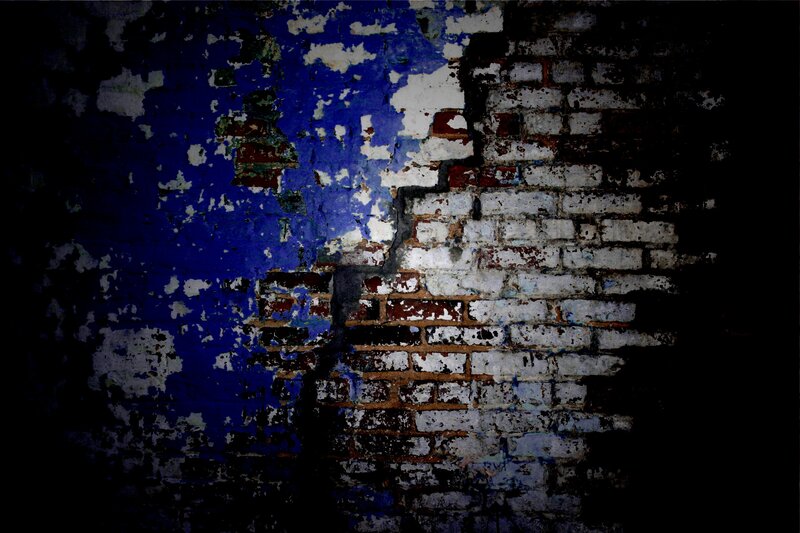 peeling paint on brick wall