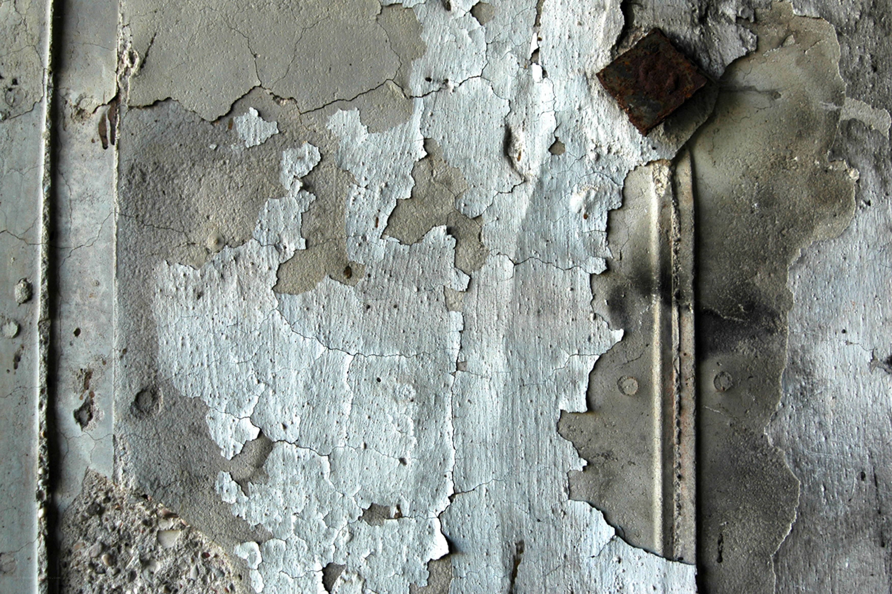 peeling paint on concrete wall