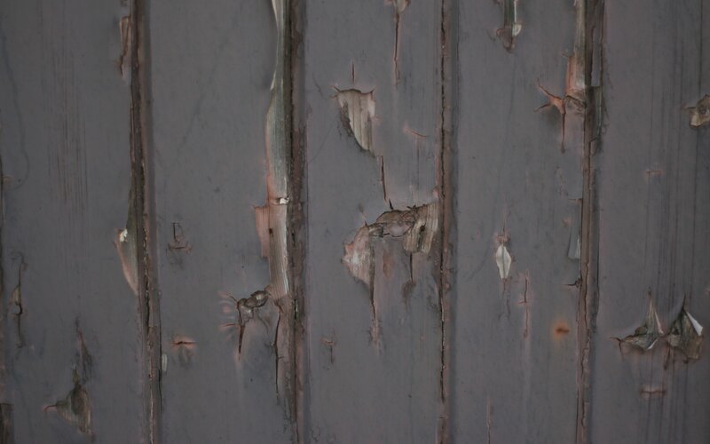 peeling paint on wooden surface