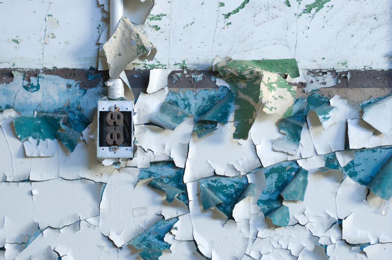 peeling paint wall with outlet
