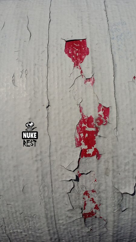 Peeling Red Paint on Wall