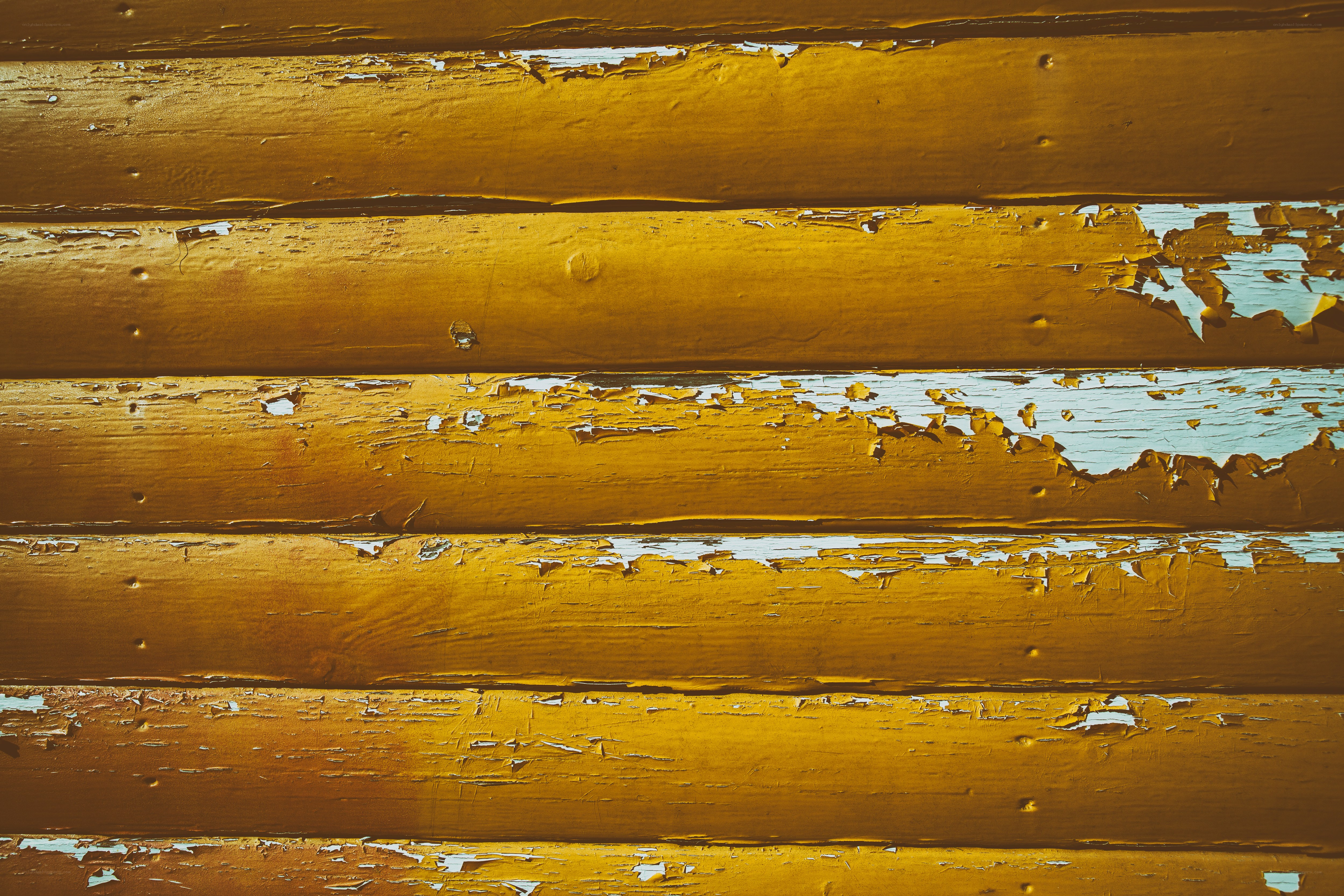 peeling yellow paint on wood