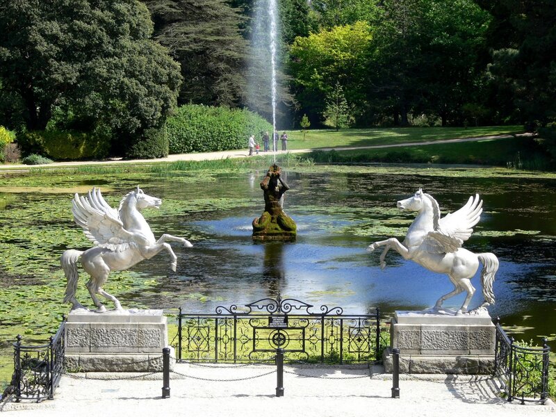 Pegasus statues by a pond