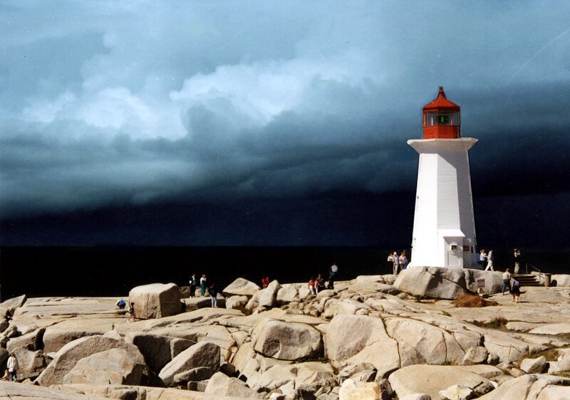 Peggy's Cove lighthouse under stormy sky