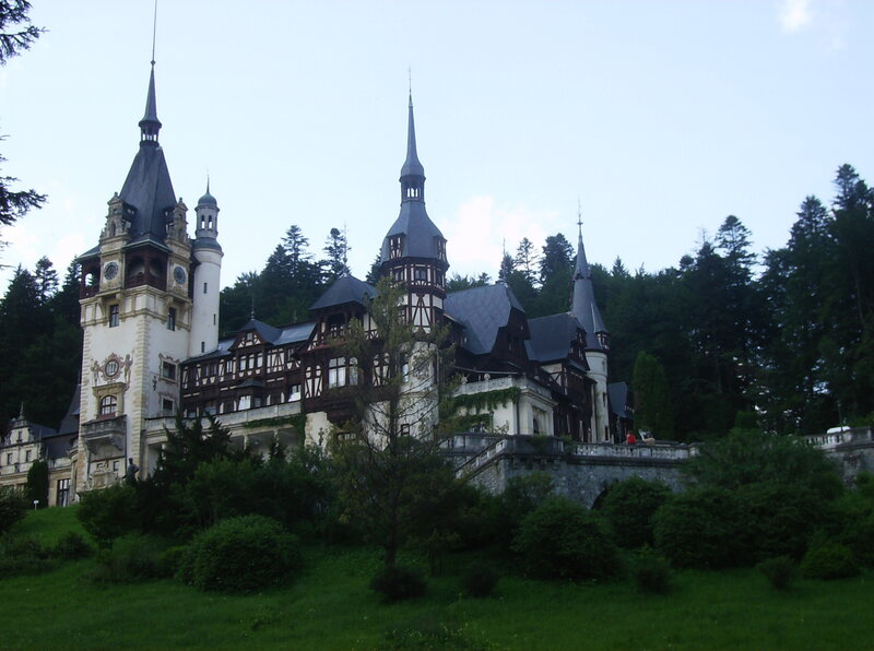 Peleș Castle — Green, Serene, Afternoon, Photograph, Towers, Trees, Grass, White, Gray