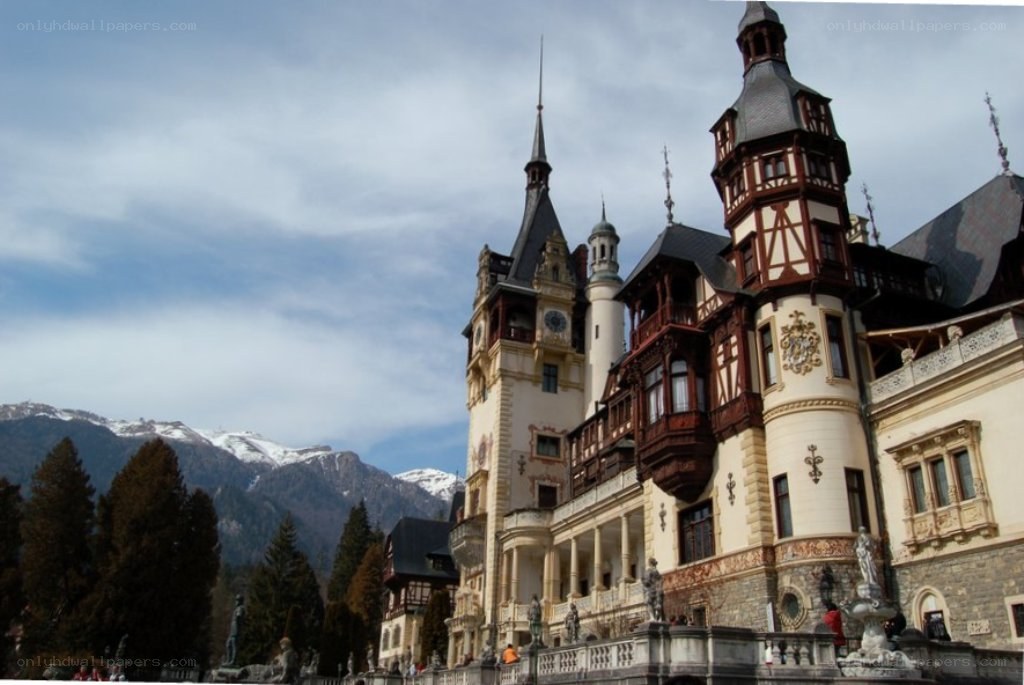 Peleș Castle with mountains