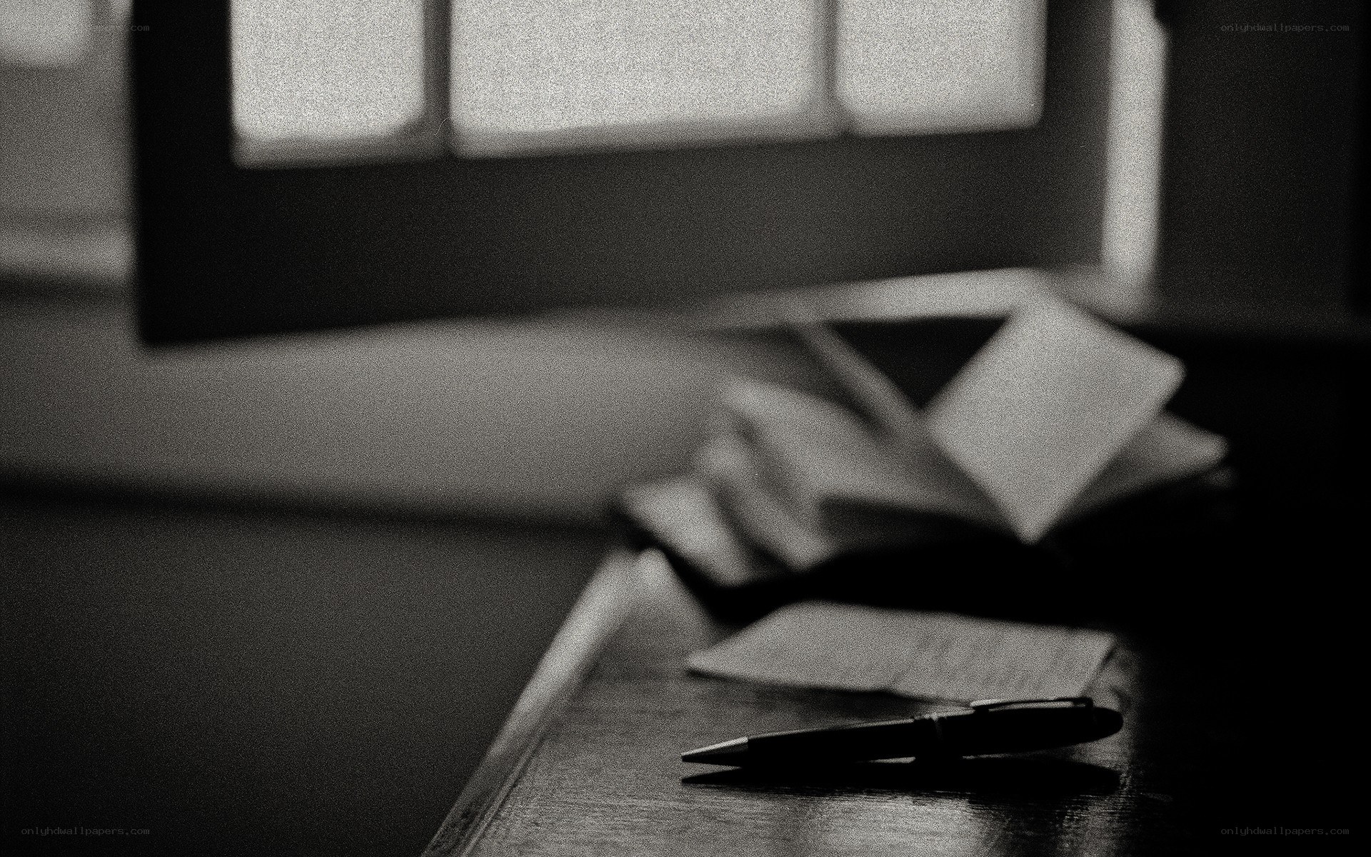 pen on a desk with papers
