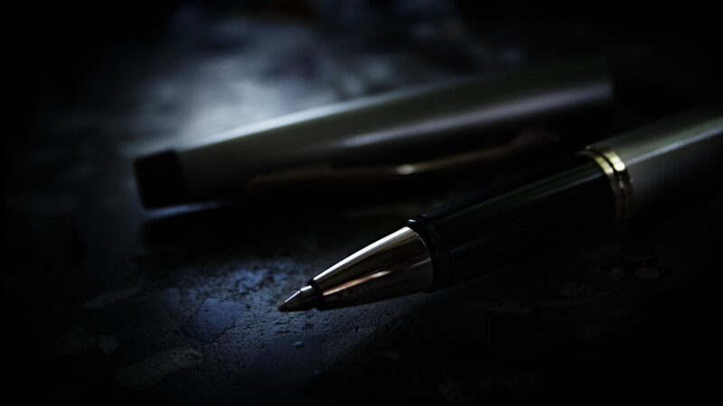 Pen on dark surface