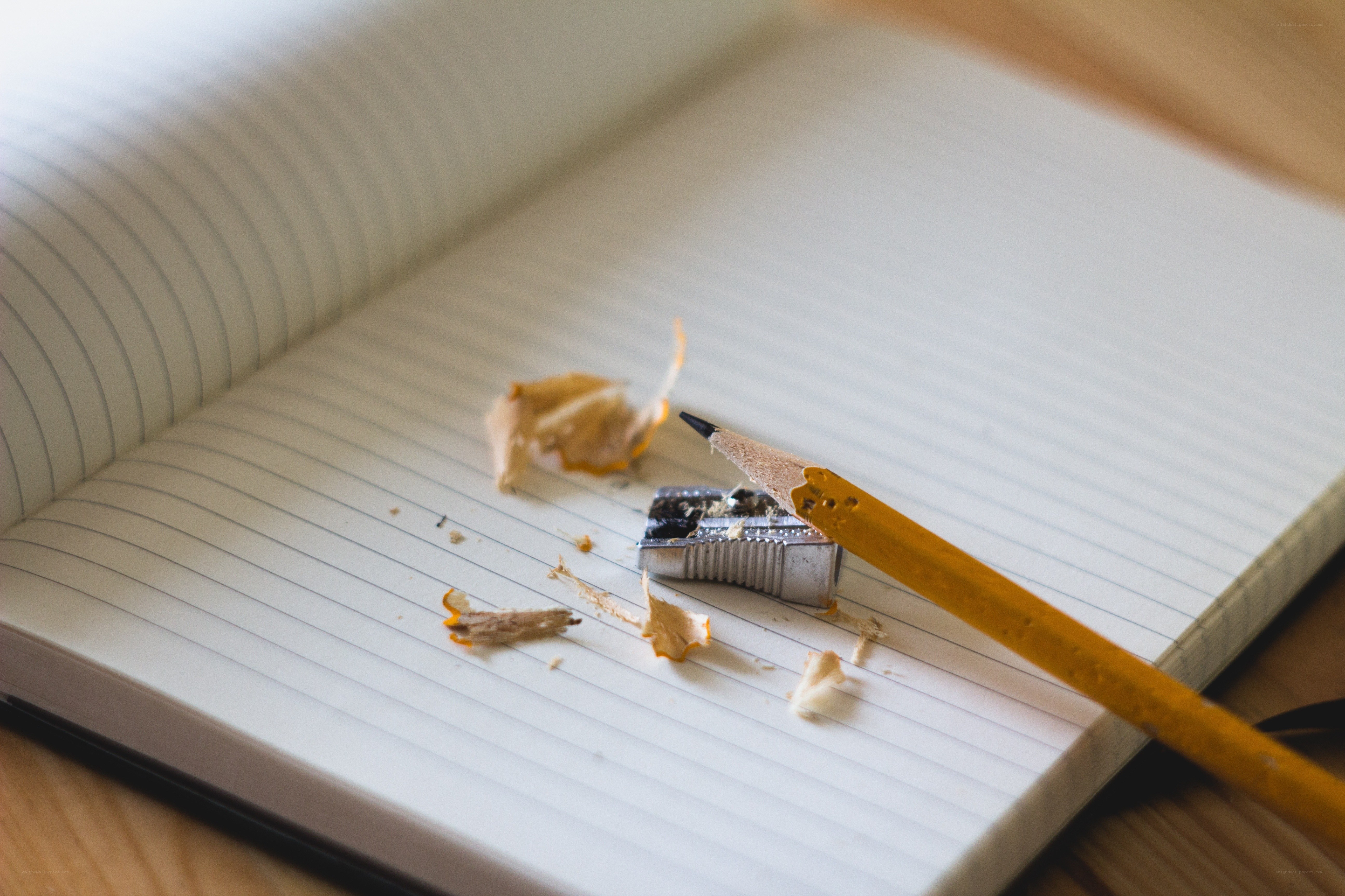 pencil and notebook on desk
