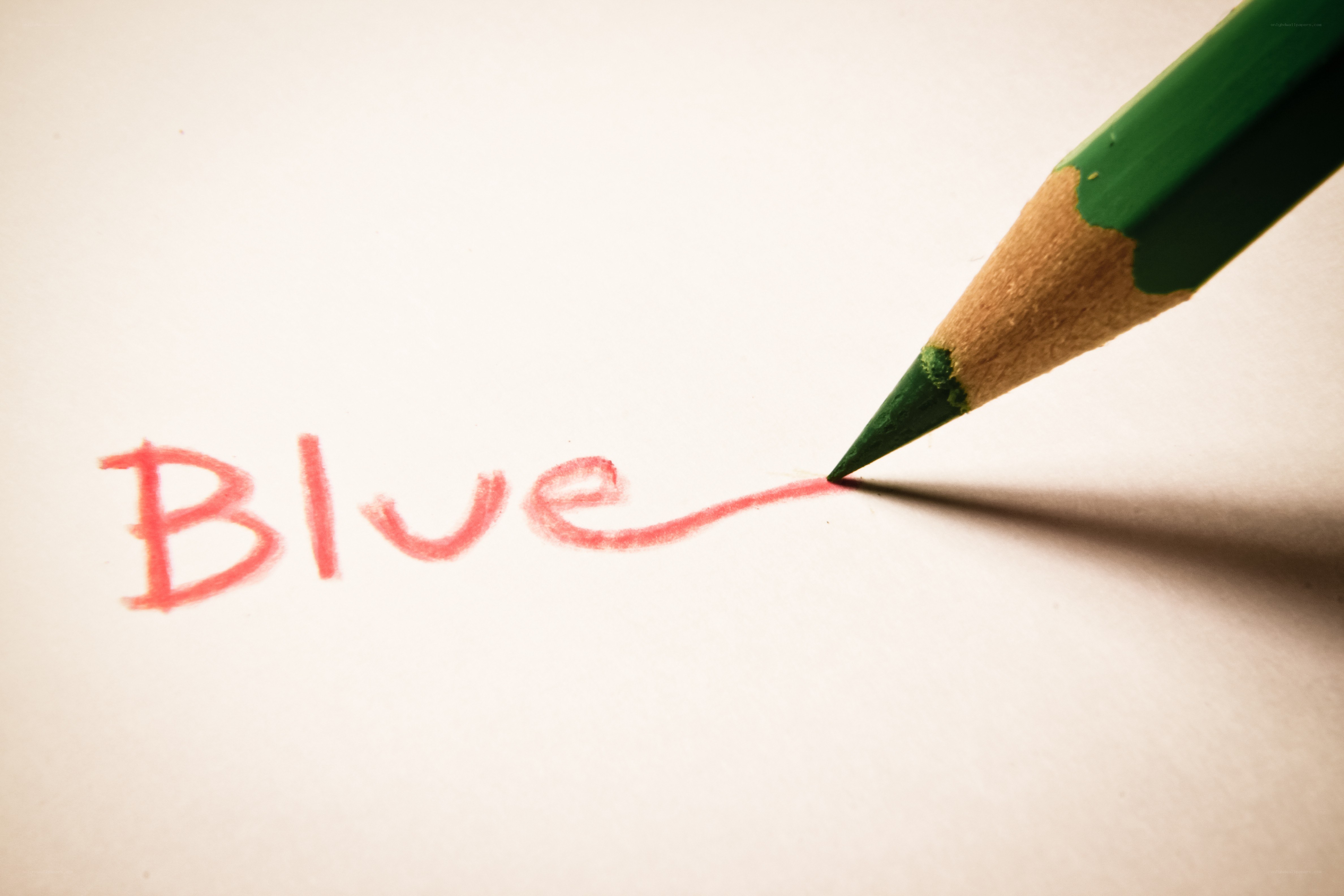 pencil writing the word blue