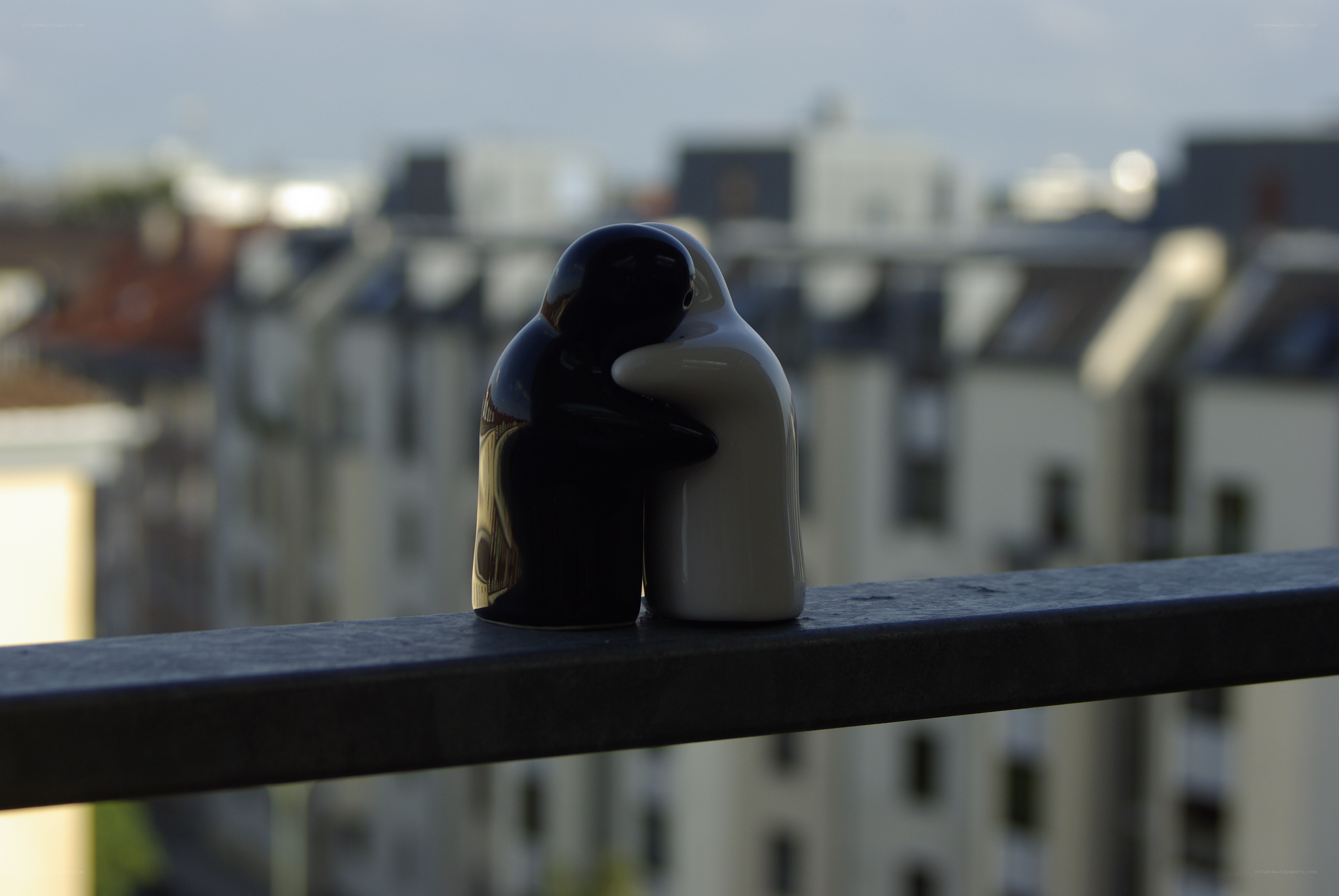 Penguin figurines on a balcony