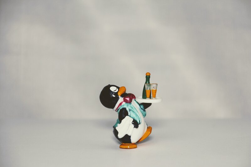 Penguin waiter figurine