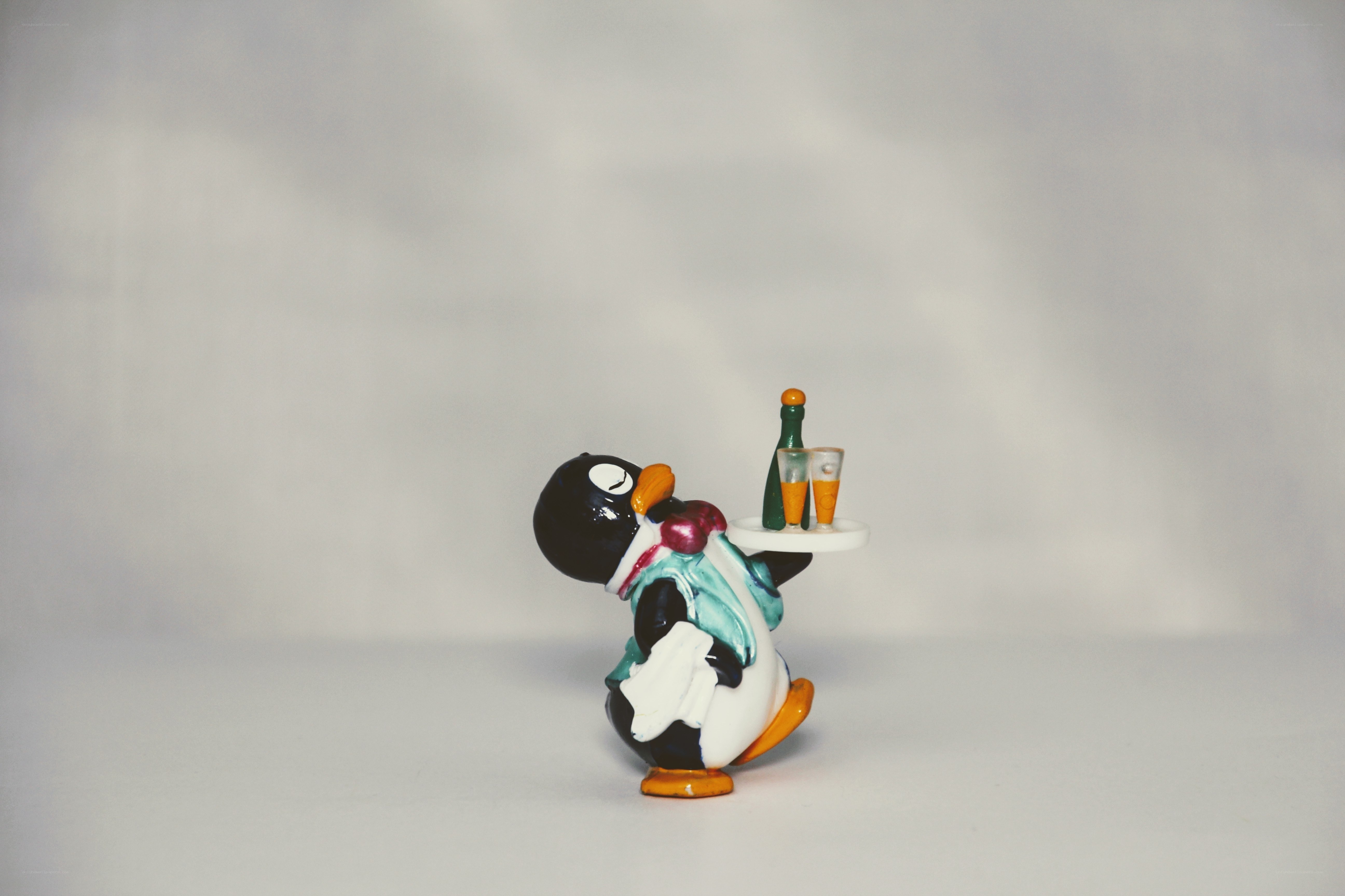Penguin waiter figurine