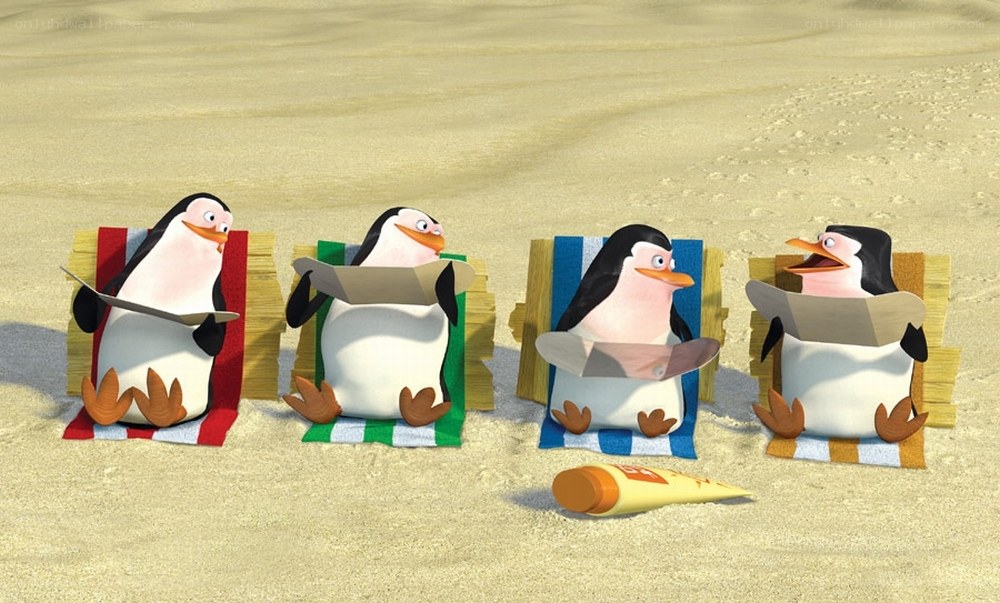 penguins on beach chairs