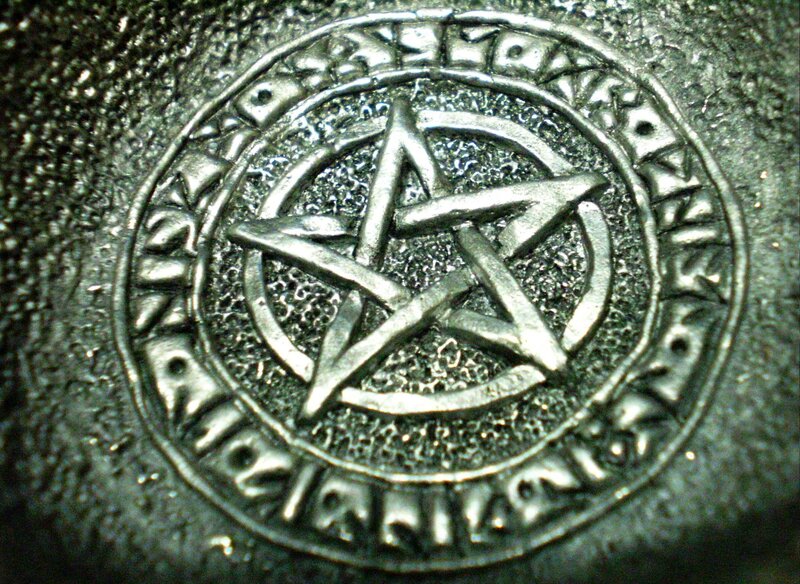 pentagram symbol on metal