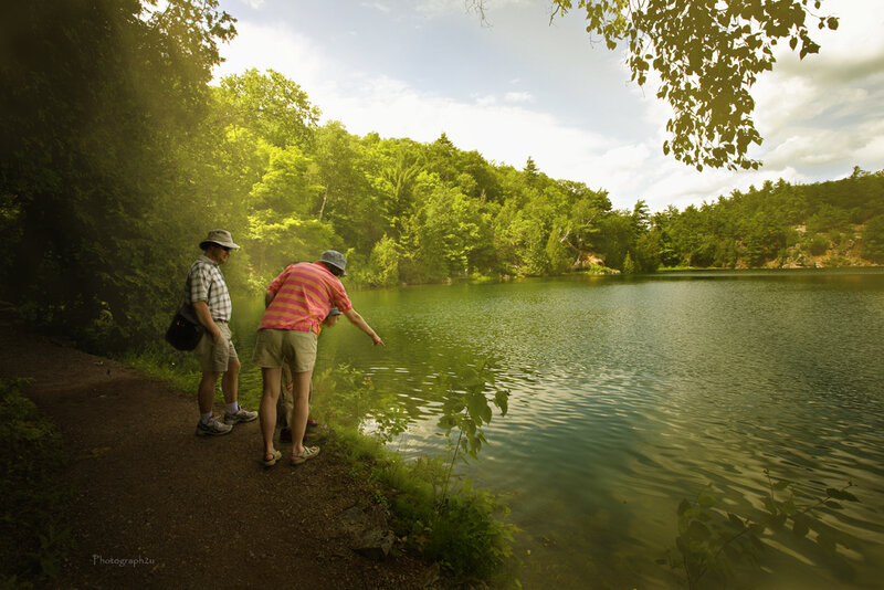 People at a lakeside path