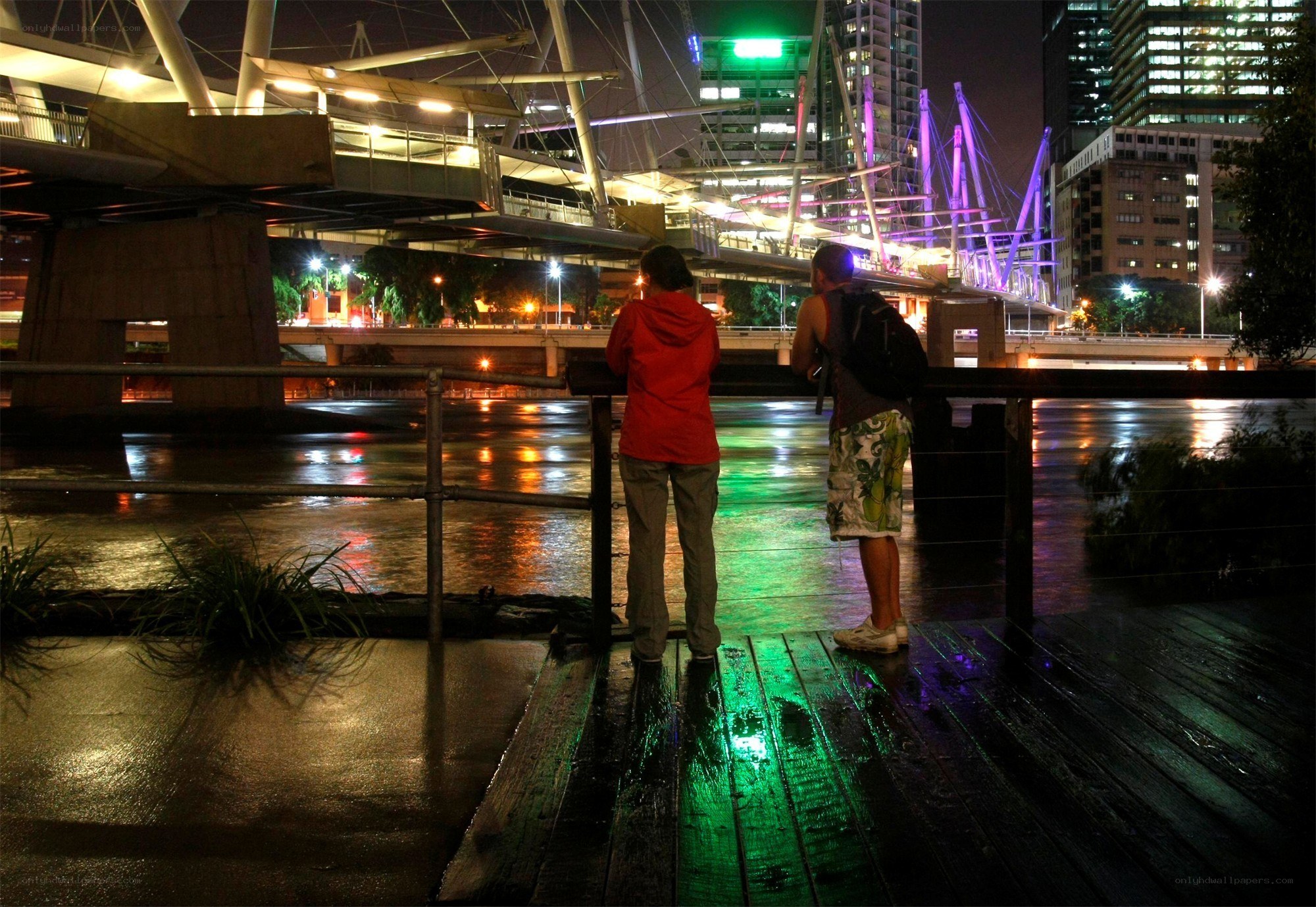 People at a riverside at night
