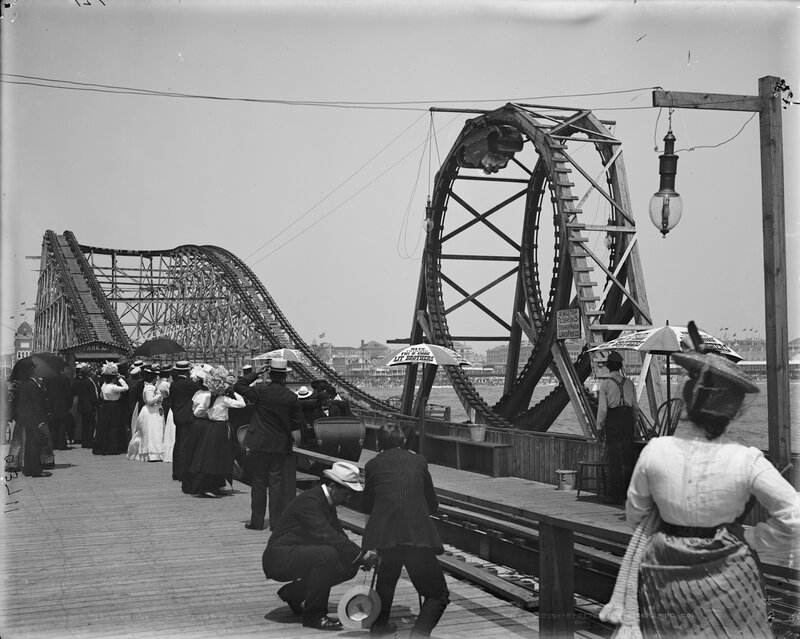 People at a seaside amusement park