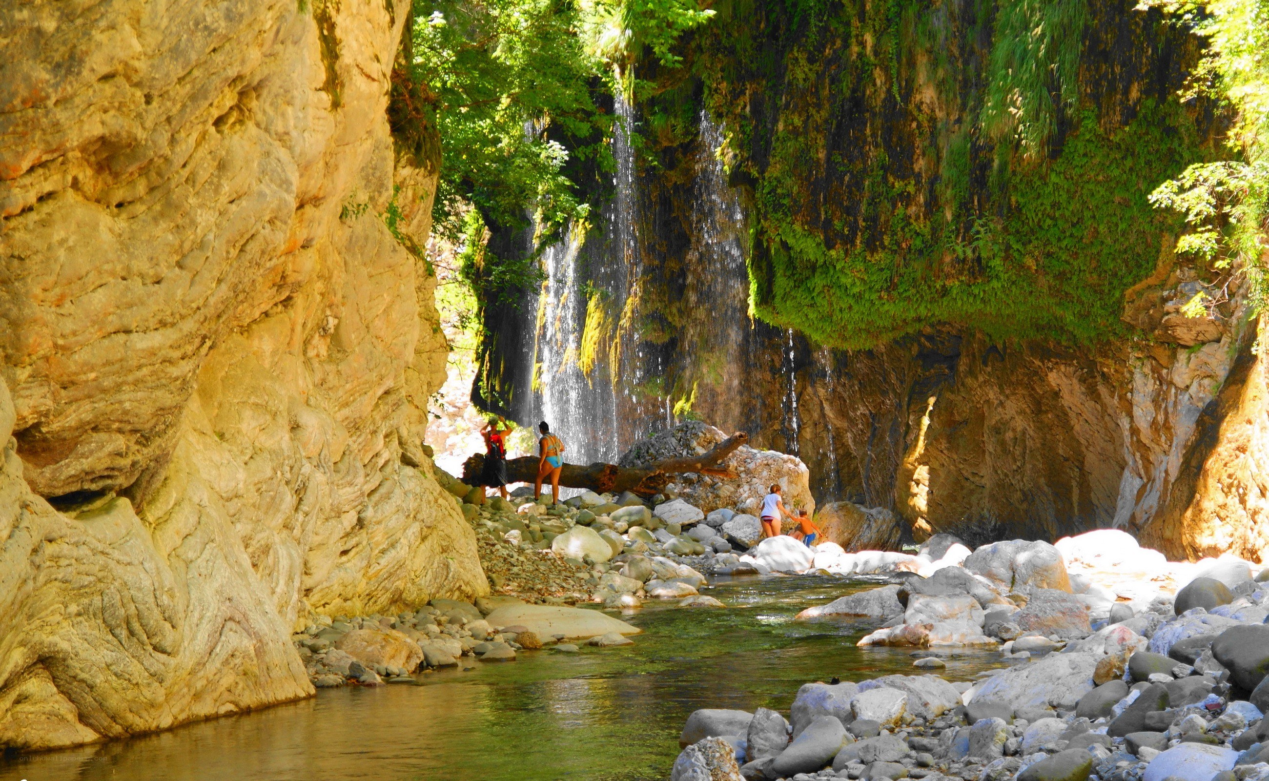 People at a waterfall canyon