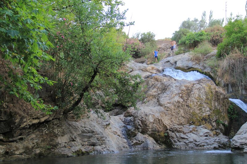 People at a Waterfall — Green