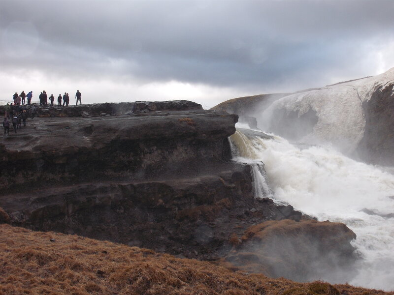 People at a waterfall overlook