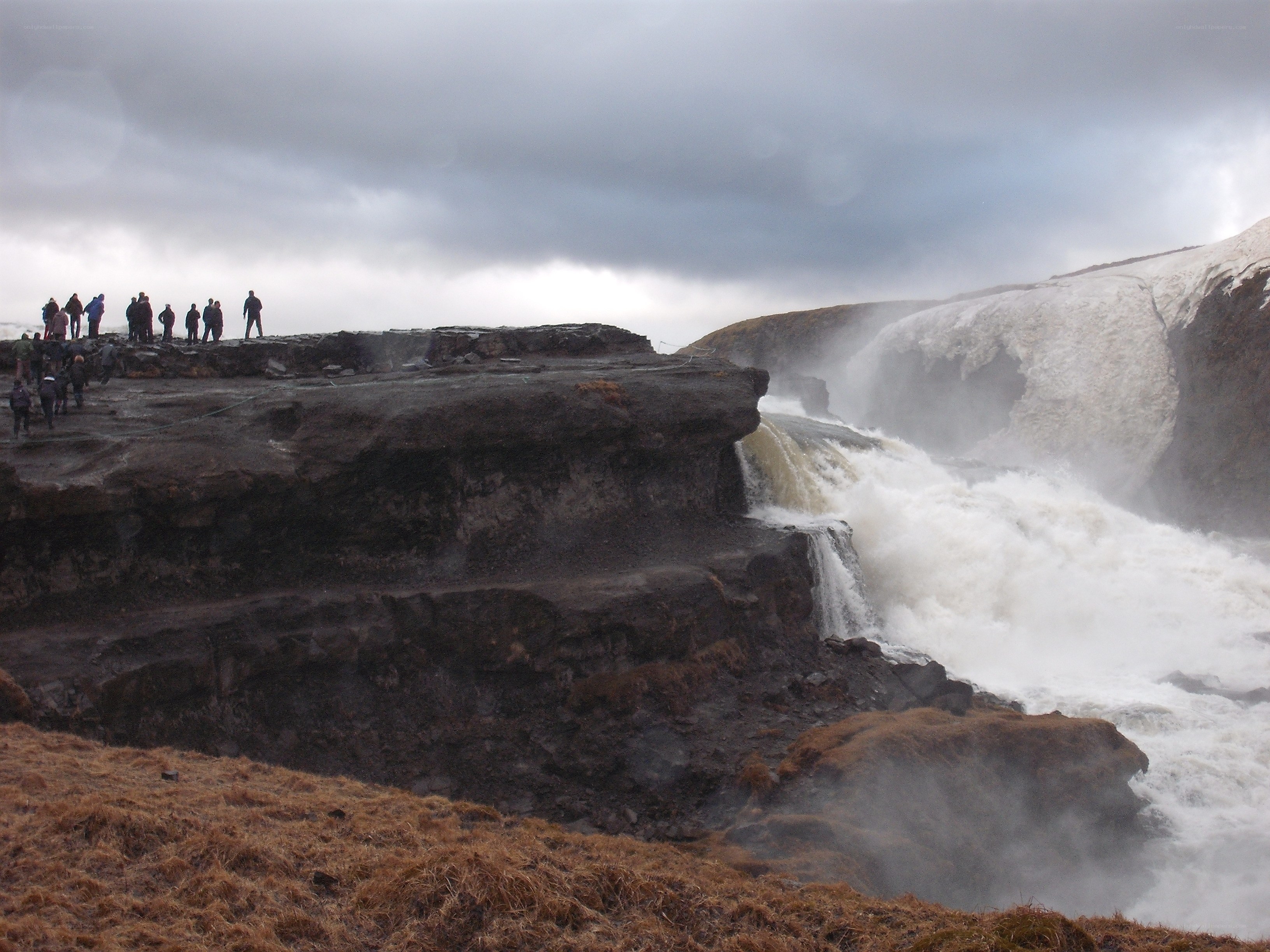 People at a waterfall overlook