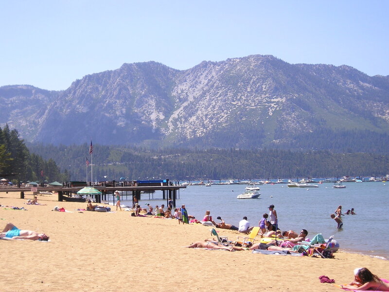 People at Beach with Mountains