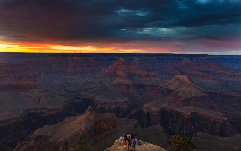 People at Canyon Edge — Orange