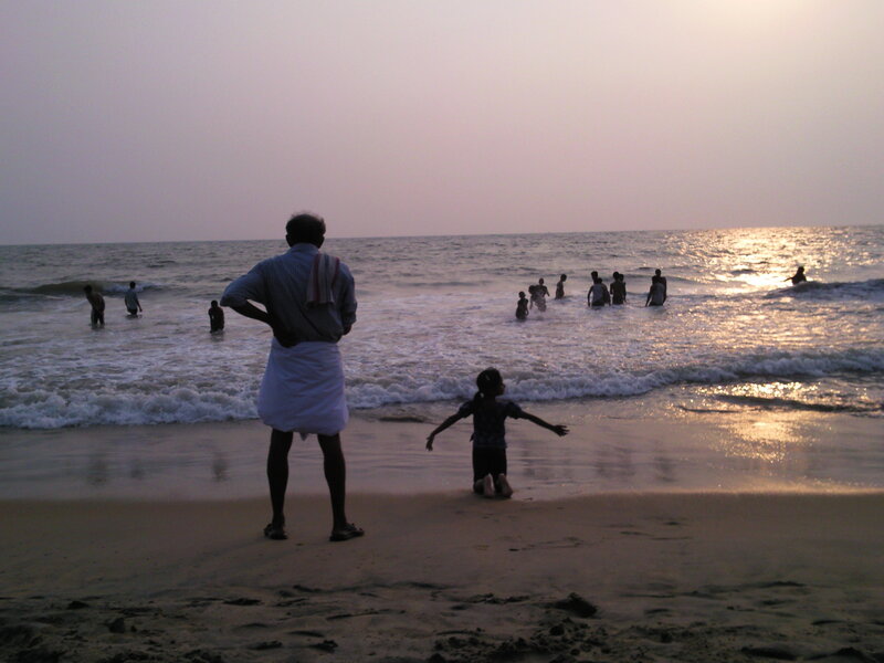 People at the beach at sunset