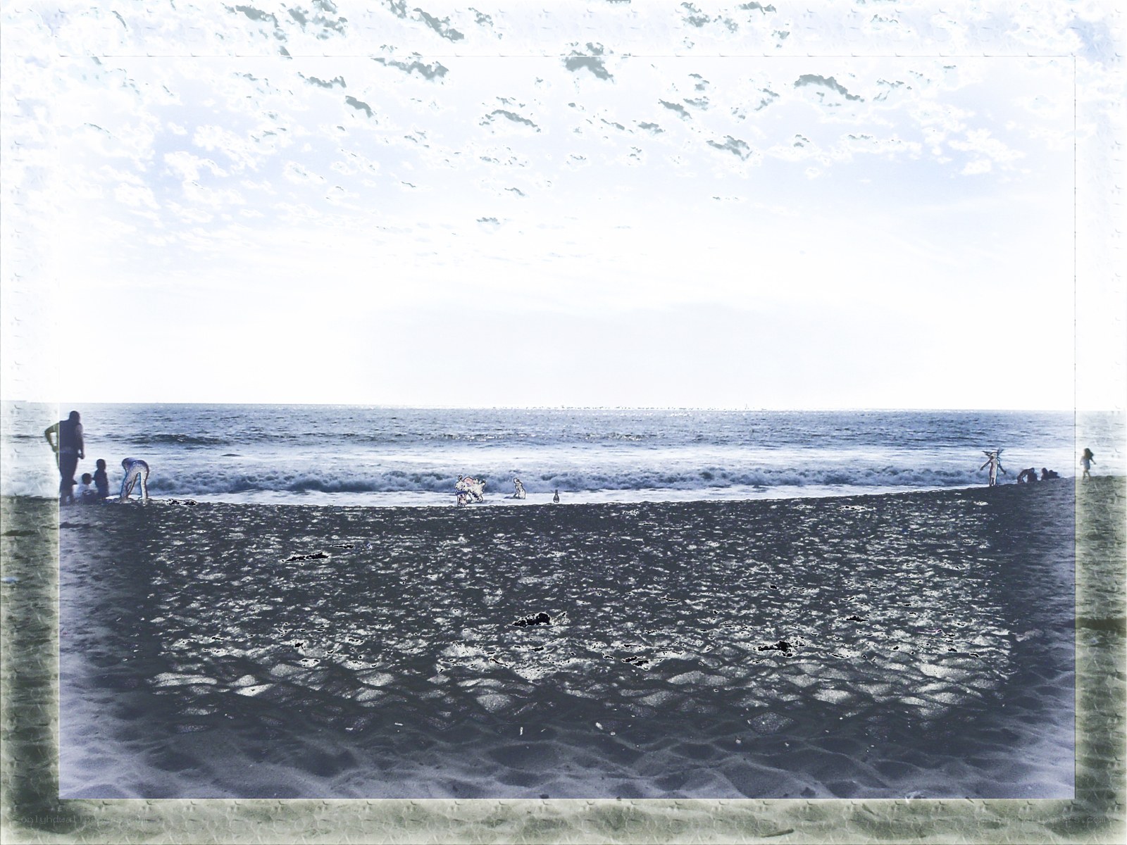 People at the beach on a cloudy day