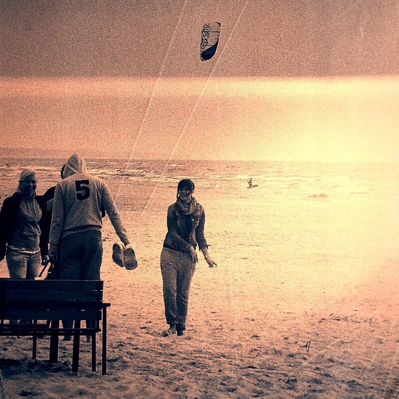 People at the beach with a kite