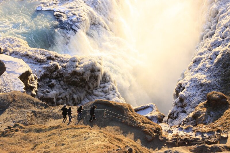 People at Waterfall — Brown