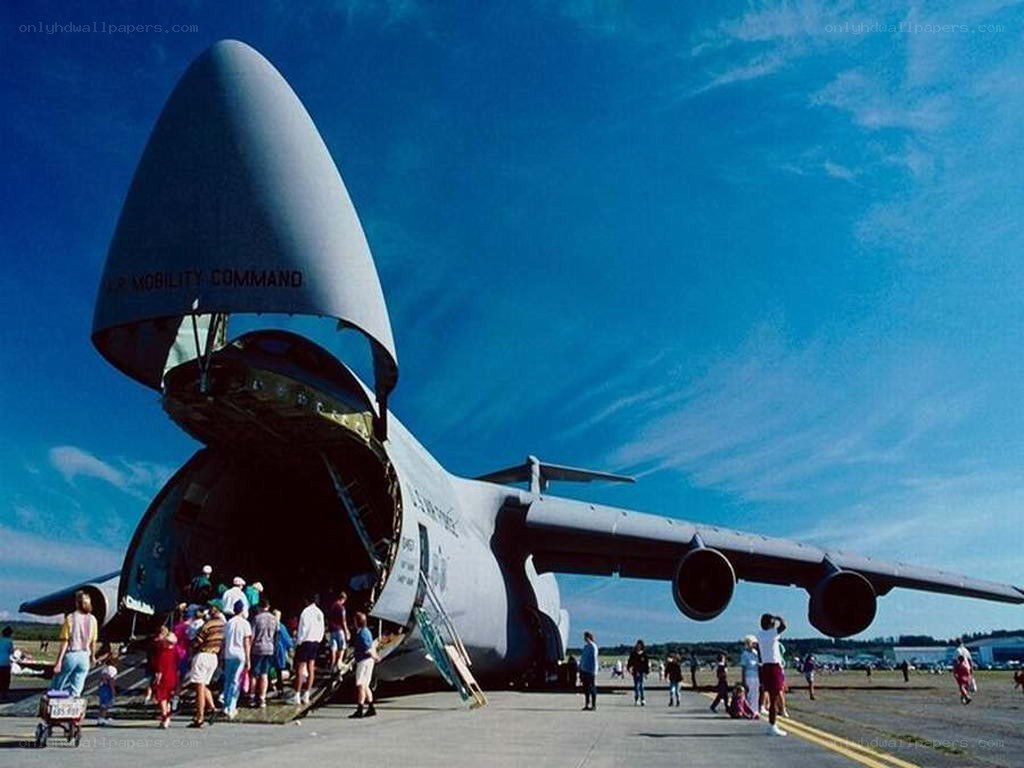 People boarding a cargo plane