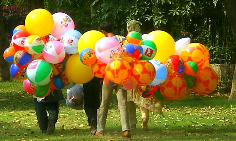 People Carrying Balloons