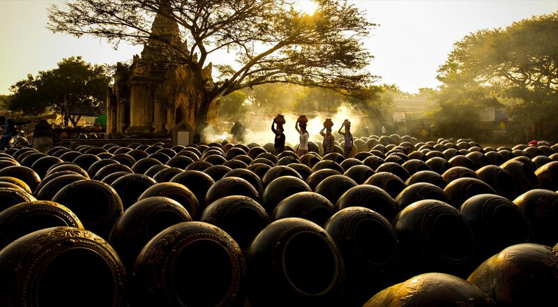 People Carrying Pots