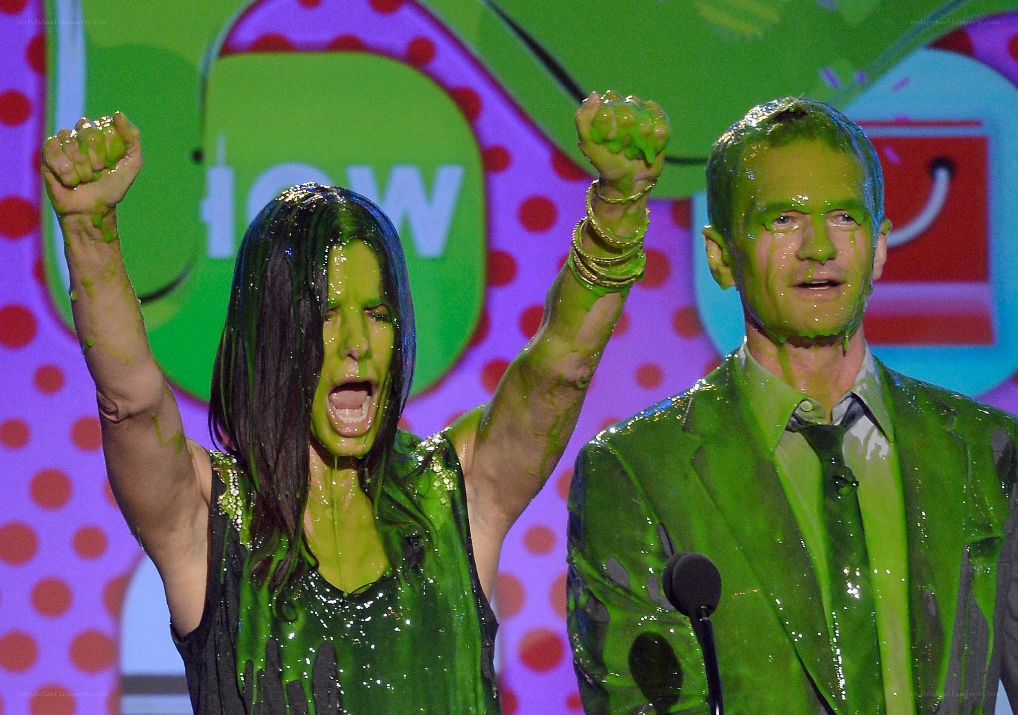 People covered in green slime