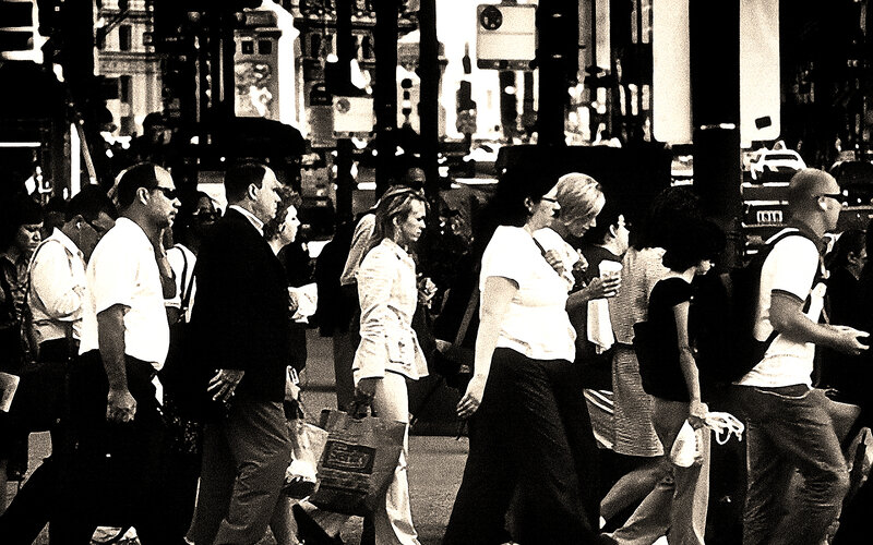 People crossing a busy street