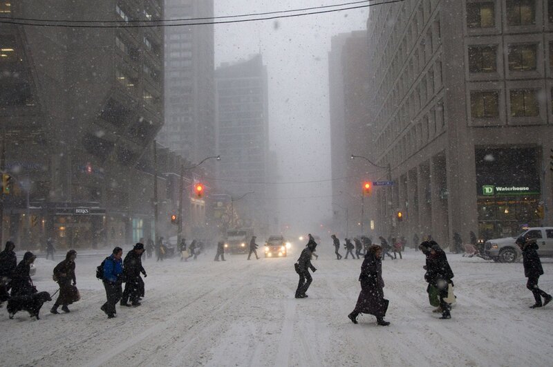 People crossing street in snowstorm