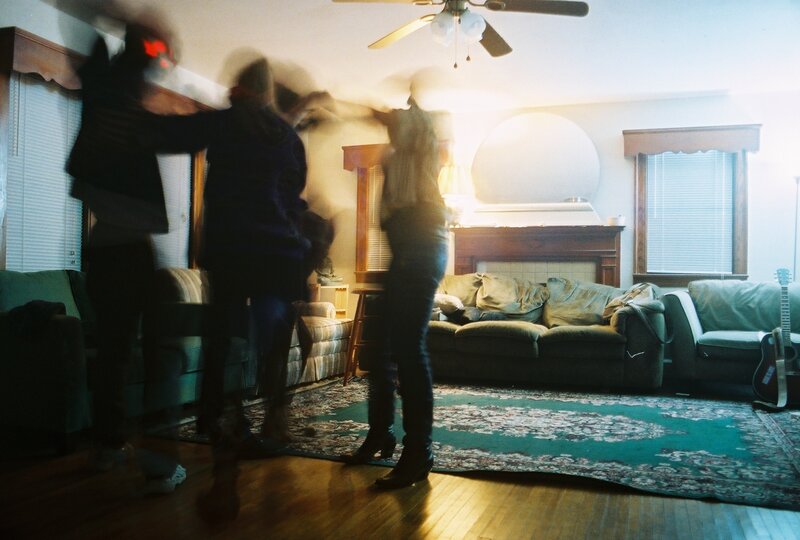 People dancing in a living room