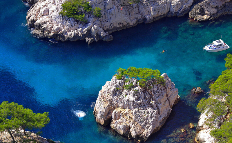 People Diving into Sea
