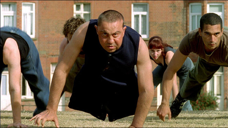 People doing push-ups outdoors