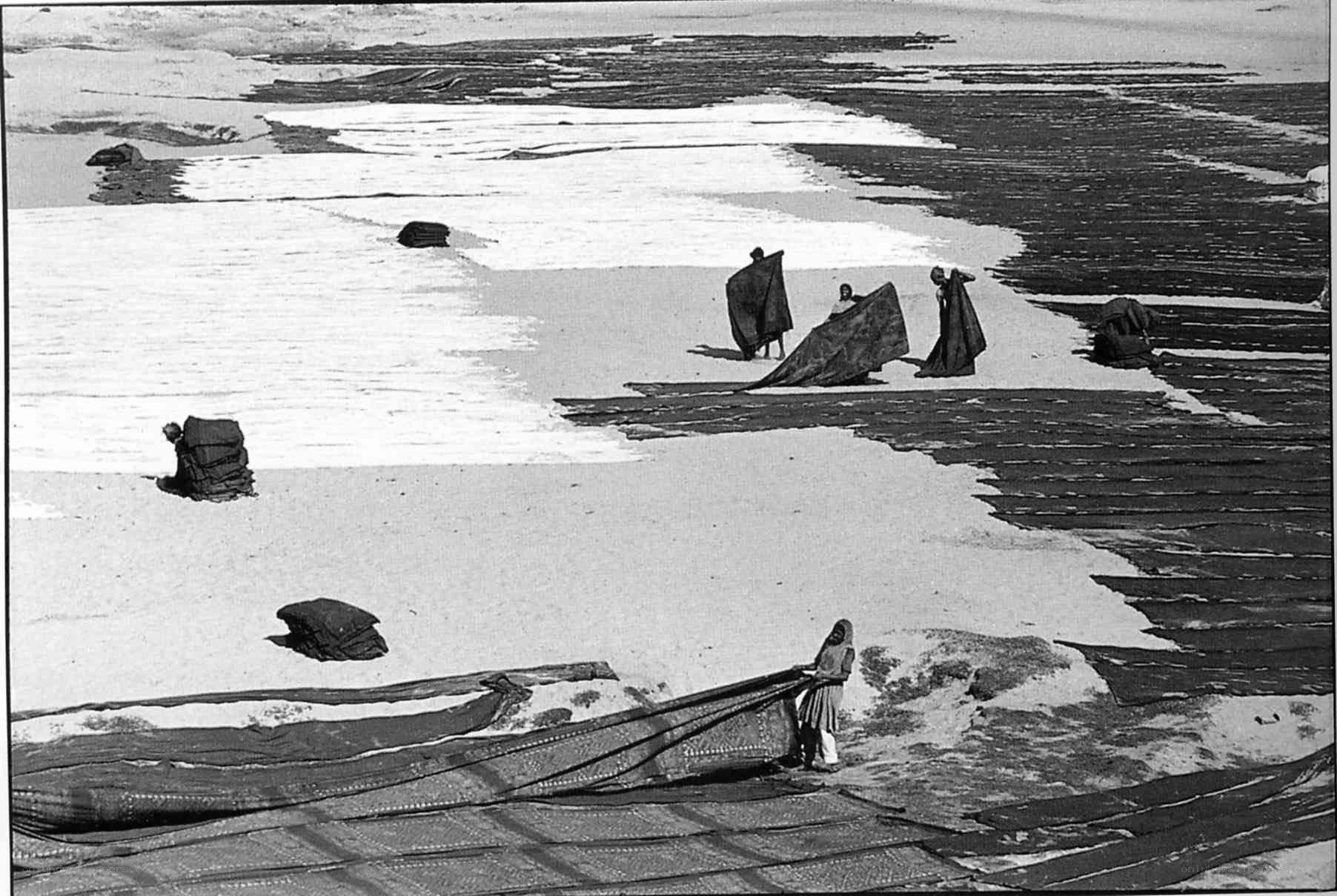 People drying textiles outdoors
