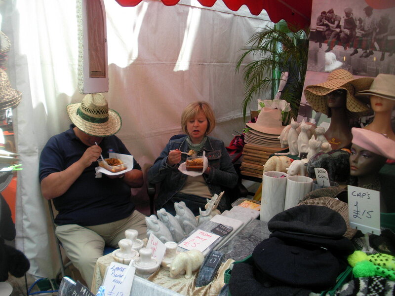 People eating at a market stall